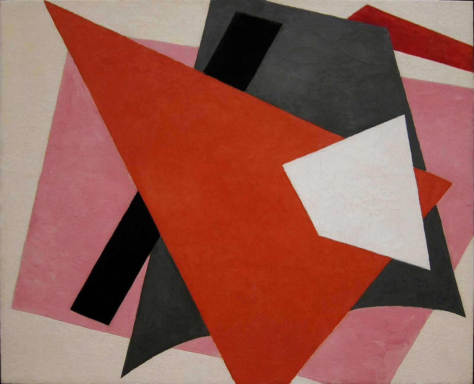 Large overlapping planes of red, black, grey and white on a pink ground, with a red triangle in front.